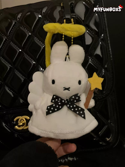 Myfunboxs Angel Miffy bag charm with yellow halo, black polka dot bow, holding star wand on glossy black handbag